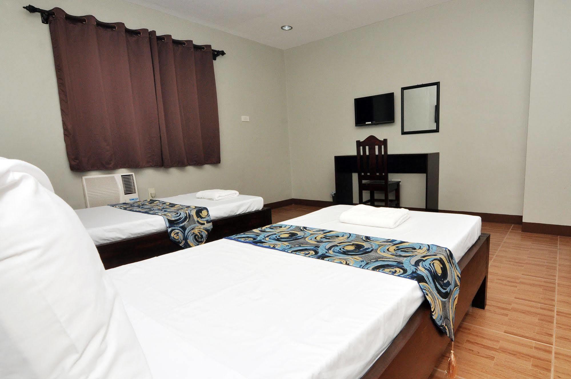 Harbour Gardens Tourist Inn Тагбиларан Экстерьер фото